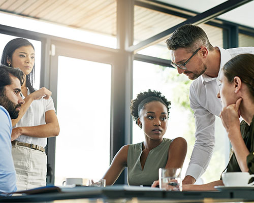 They Have Some Important Decisions To Make As A Team. Shot Of A Group Of Colleagues Working Together In An Office.