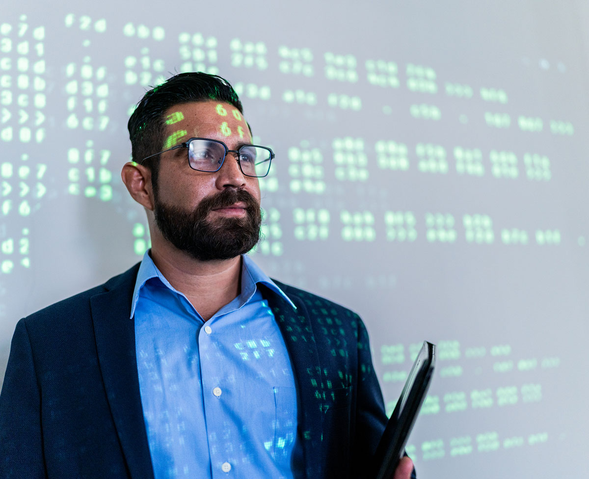 Mid Adult Businessman Looking Away At Work